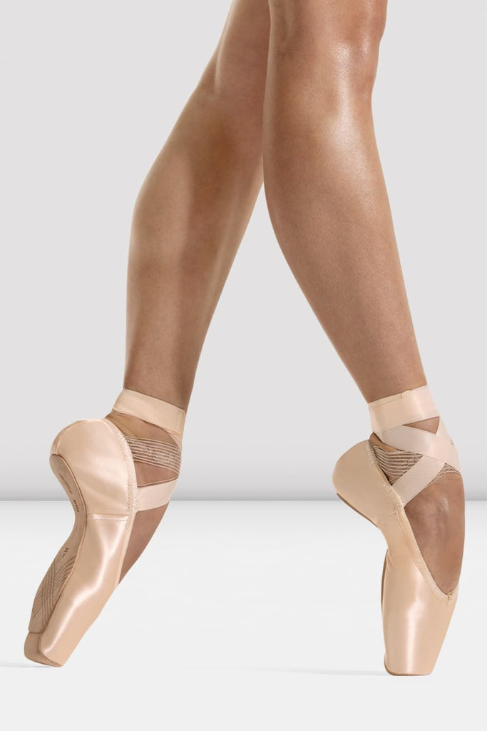 BLOCH Etu Pointe Shoes in pink satin with ribbons on models foot en pointe in fourth position