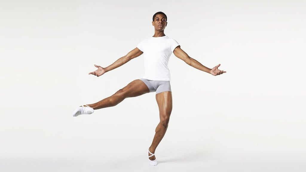 A male dancer practising ballet wearing BLOCH mens fitted t-shirt and short length rehearsal tight